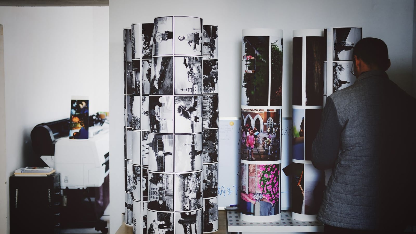 Modern 3D printing studio interior in Vienna featuring various printers and precision tools.